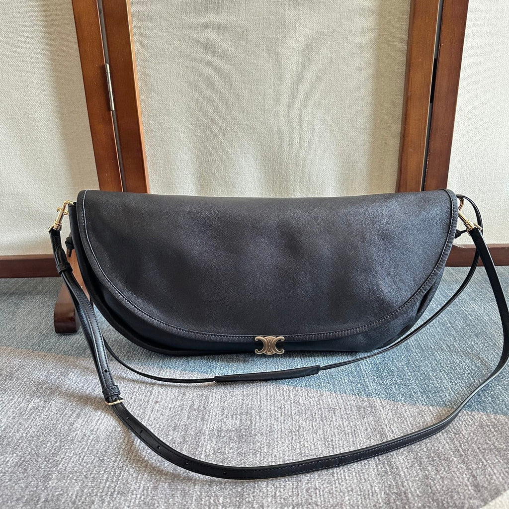 CELINE 25S HALFMOON SOFT TRIOMPHE BAG 46MM IN BLACK SUPPLE SHINY LAMBSKIN