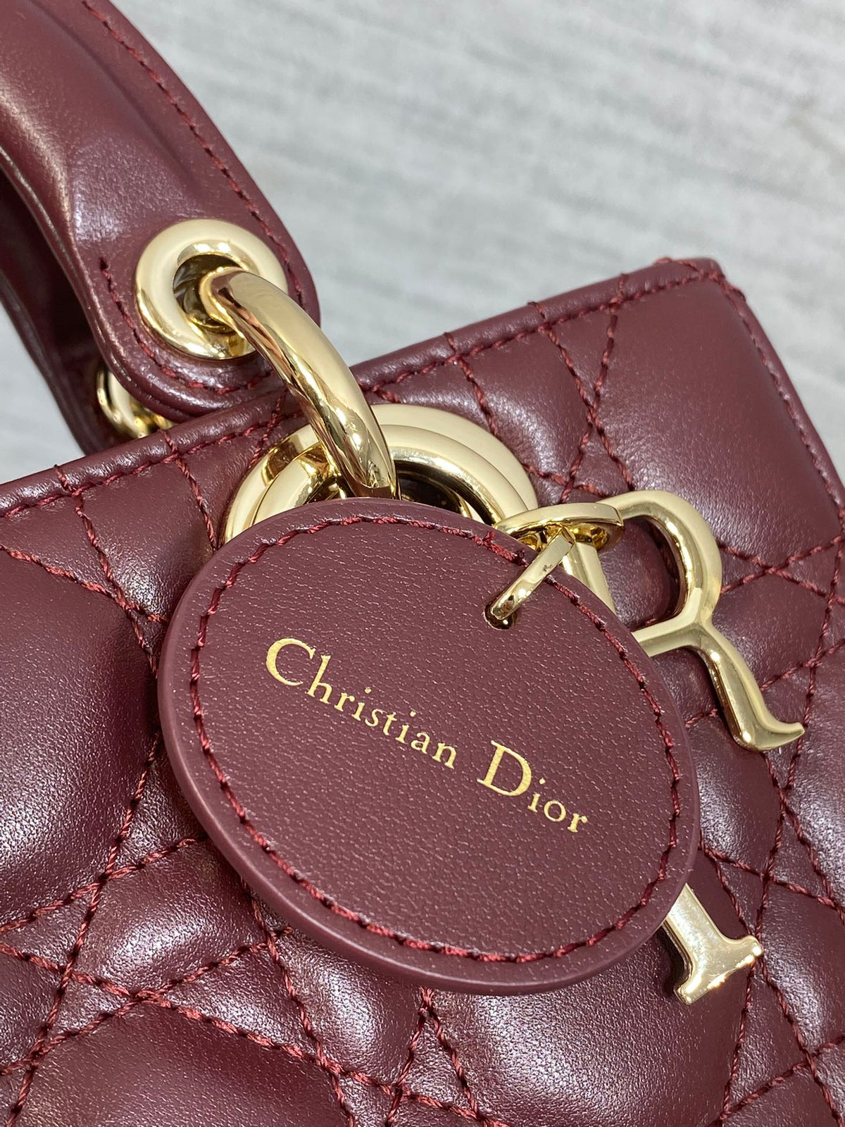 DIOR 25S SMALL LADY D‑JOY BAG 19 IN BURGUNDY CANNAGE CALFSKIN GOLD HARDWRE