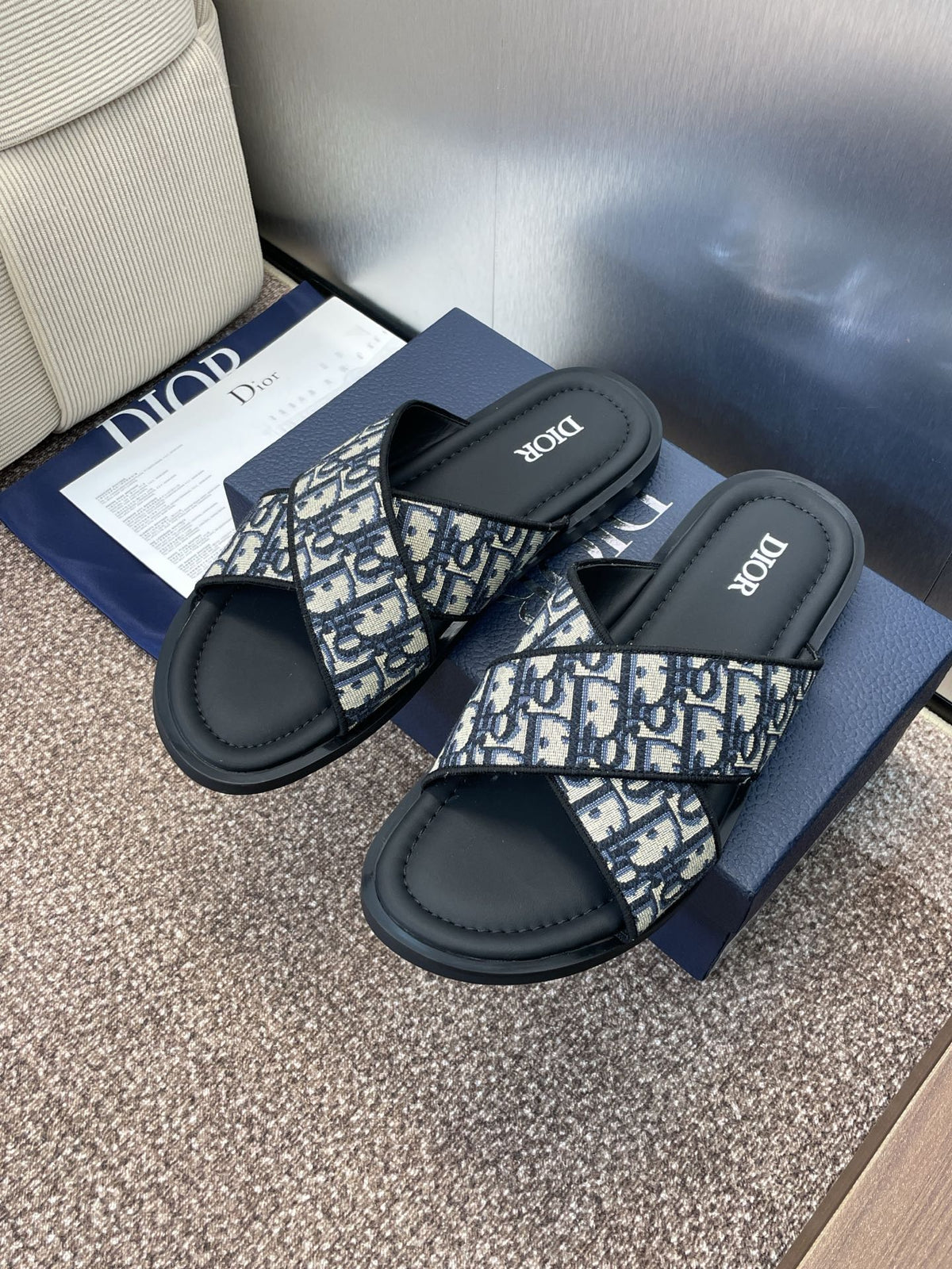 DIOR 25S ALIAS CROSS-STRAP SLIDES IN BLACK CALFSKIN WITH CD OBLIQUE DEEP BLUE LOGO